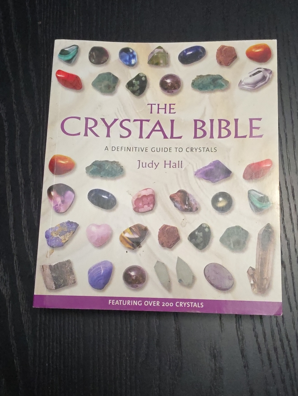 The Crystal Bible by Judy Hall — White Cover with Multicolored Crystals